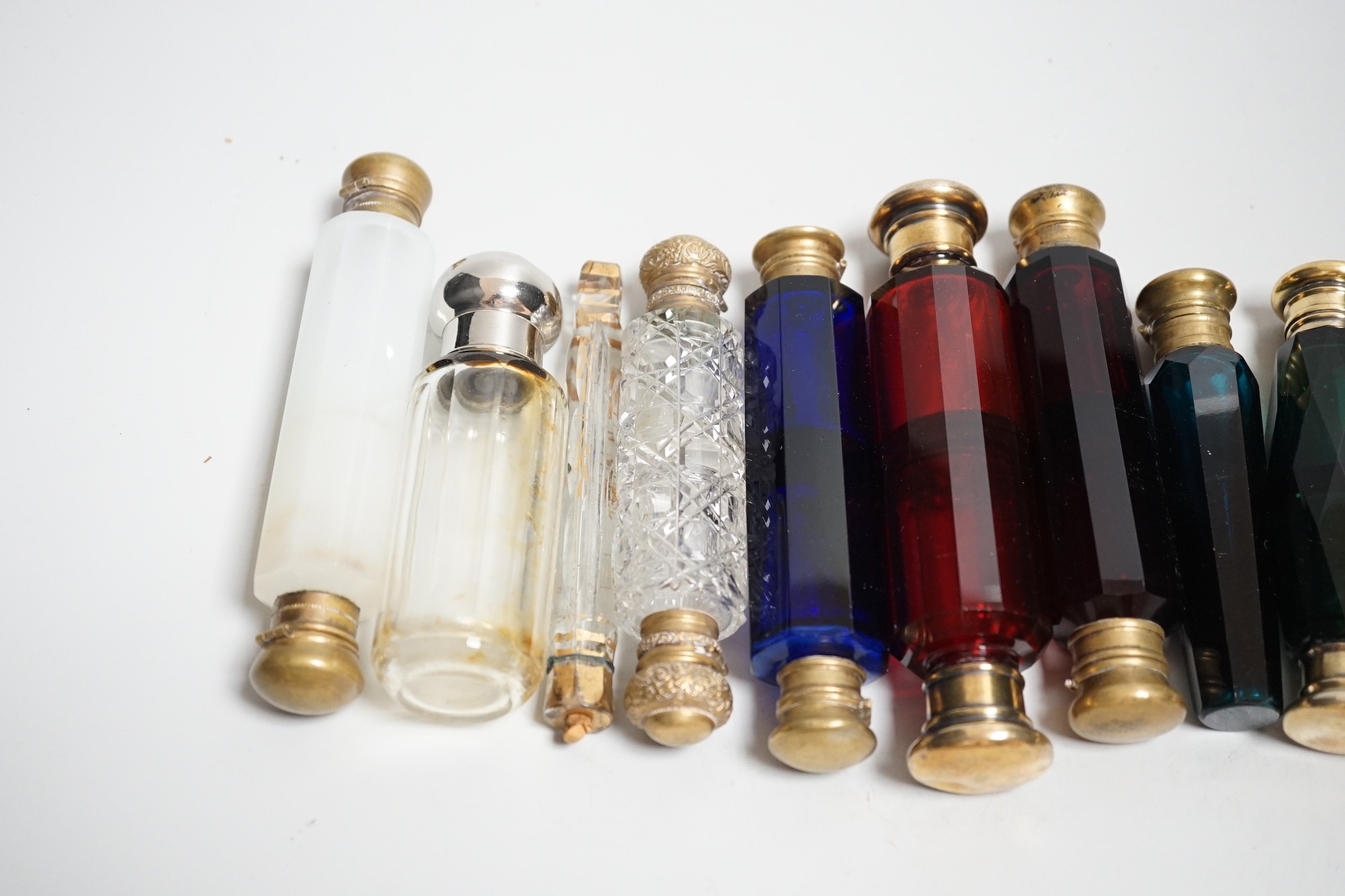 Seven 19th century coloured glass double ended scent bottles and three others